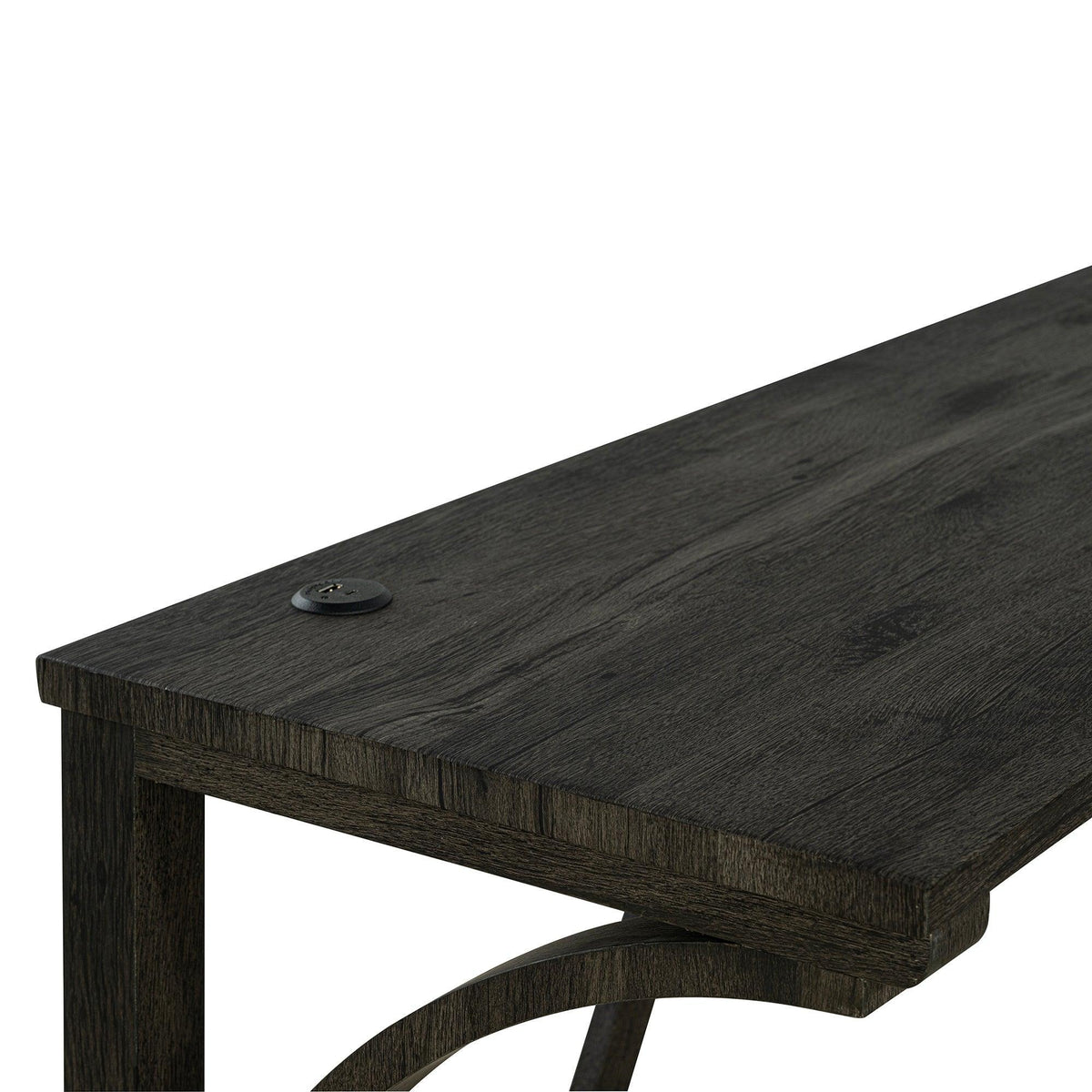 Dark brown tabletop corner with round power outlet and recessed USB-A/USB-C ports