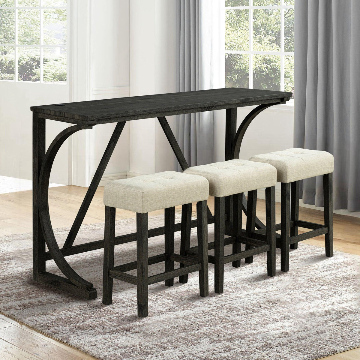Dark brown bar-height table with three beige stools, shown in a bright dining room
