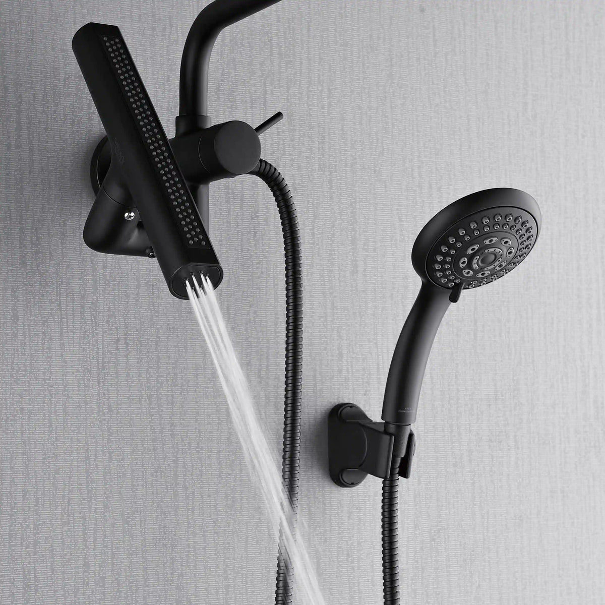 Matte black overhead rainfall head and handheld shower delivering water spray