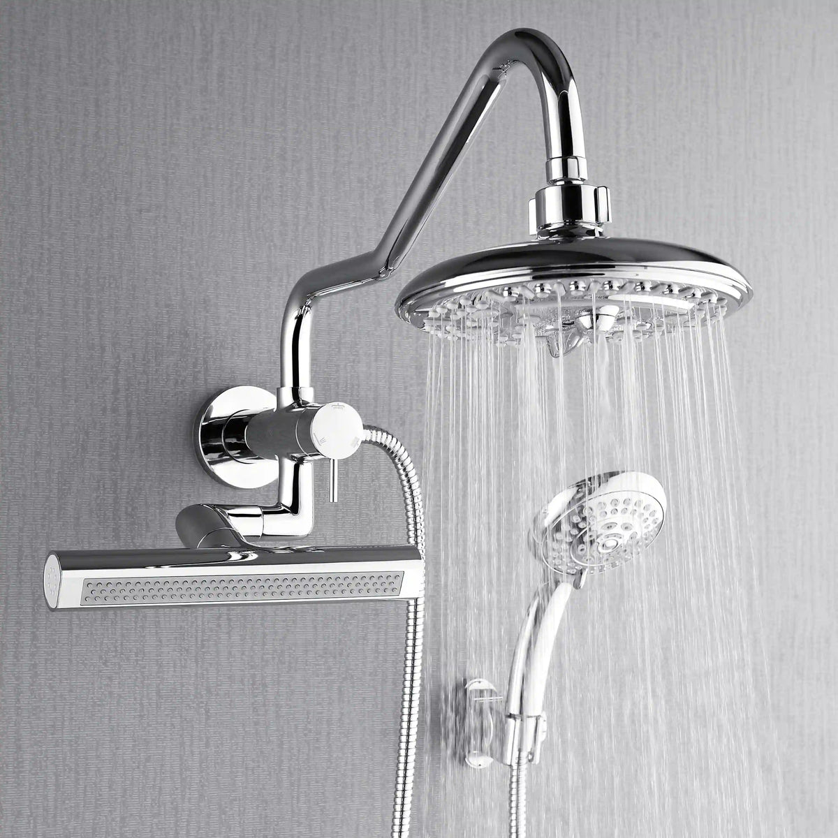 Chrome rain shower head with falling water and handheld sprayer below