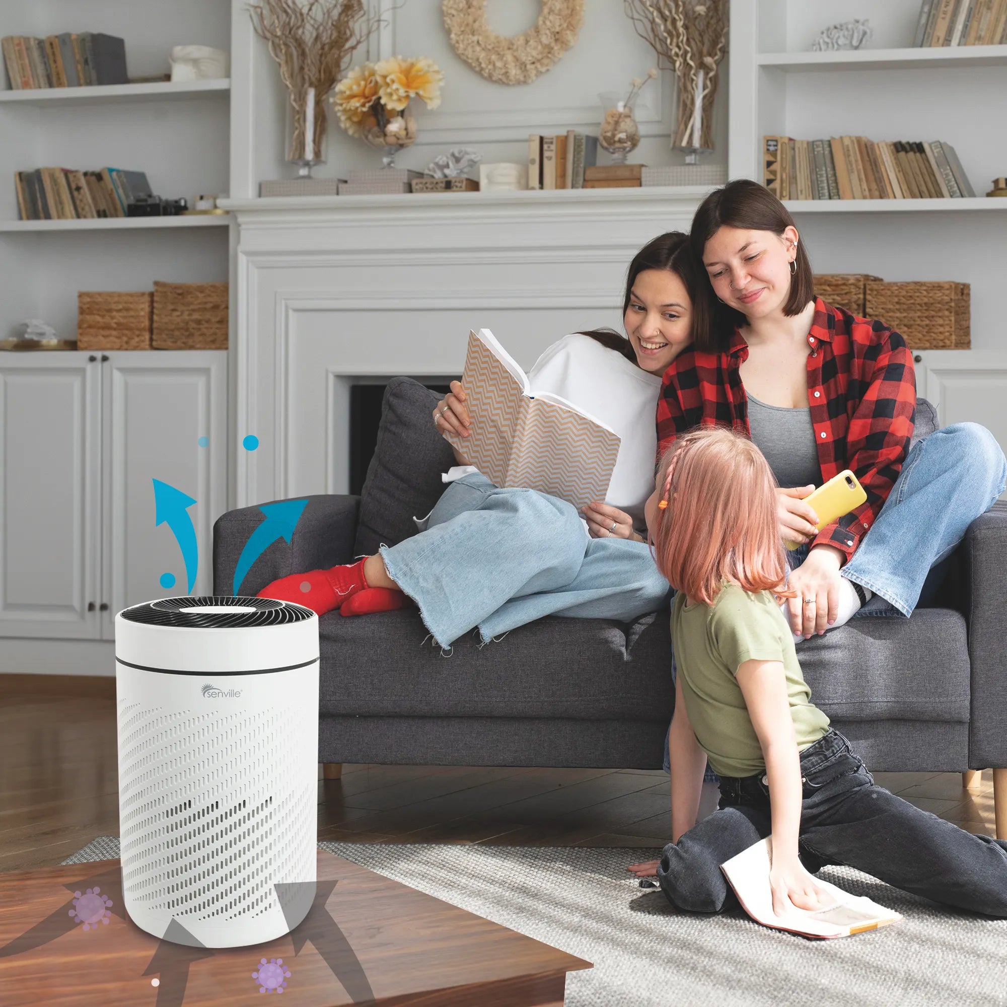 Portable air purifier and window-style mini split indoor unit near family on sofa