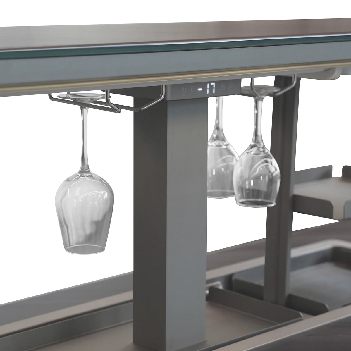 Close-up of open lift bay with hanging wine glasses over the stainless bar base.