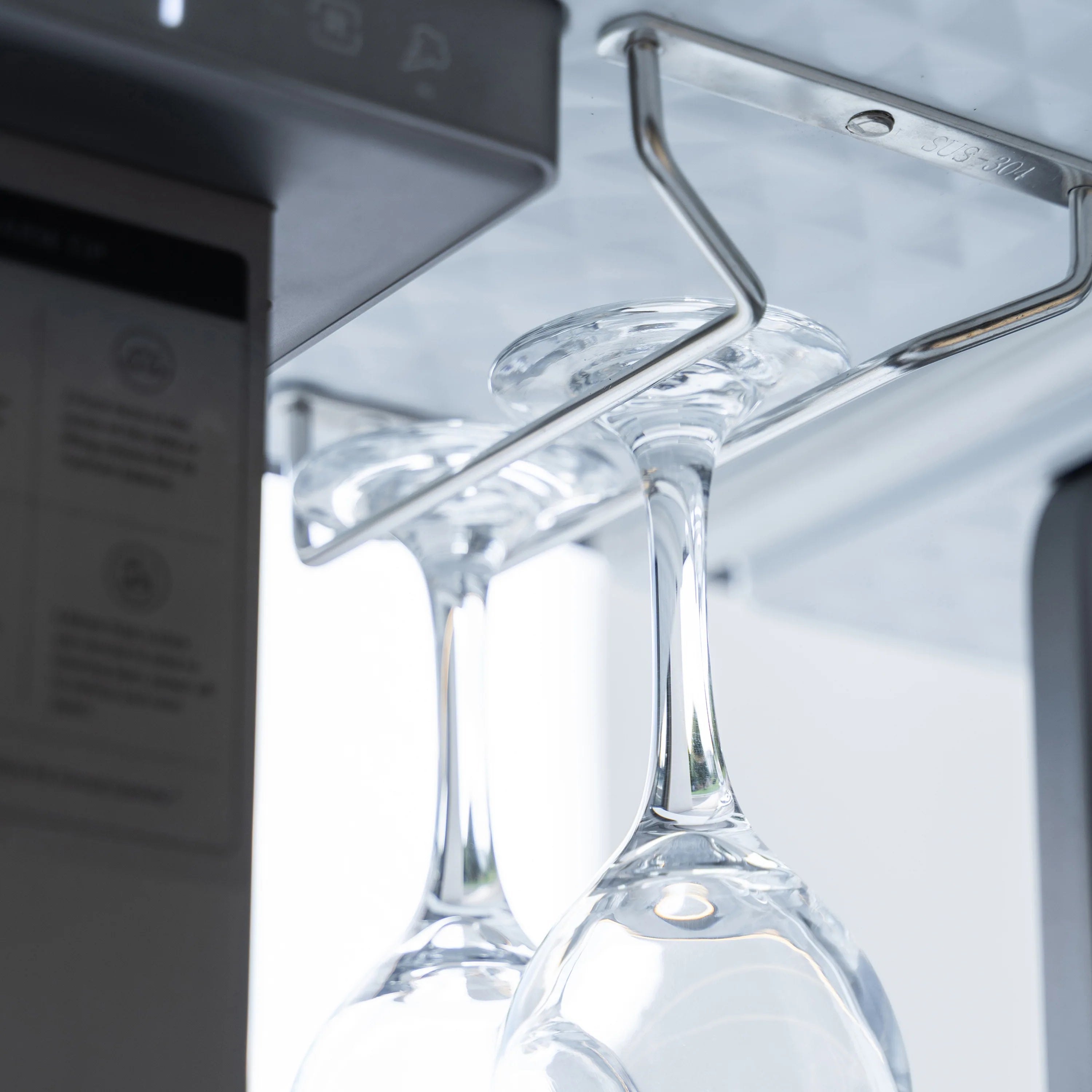 Smart dining table dispenser with chrome spout and clear glass carafe