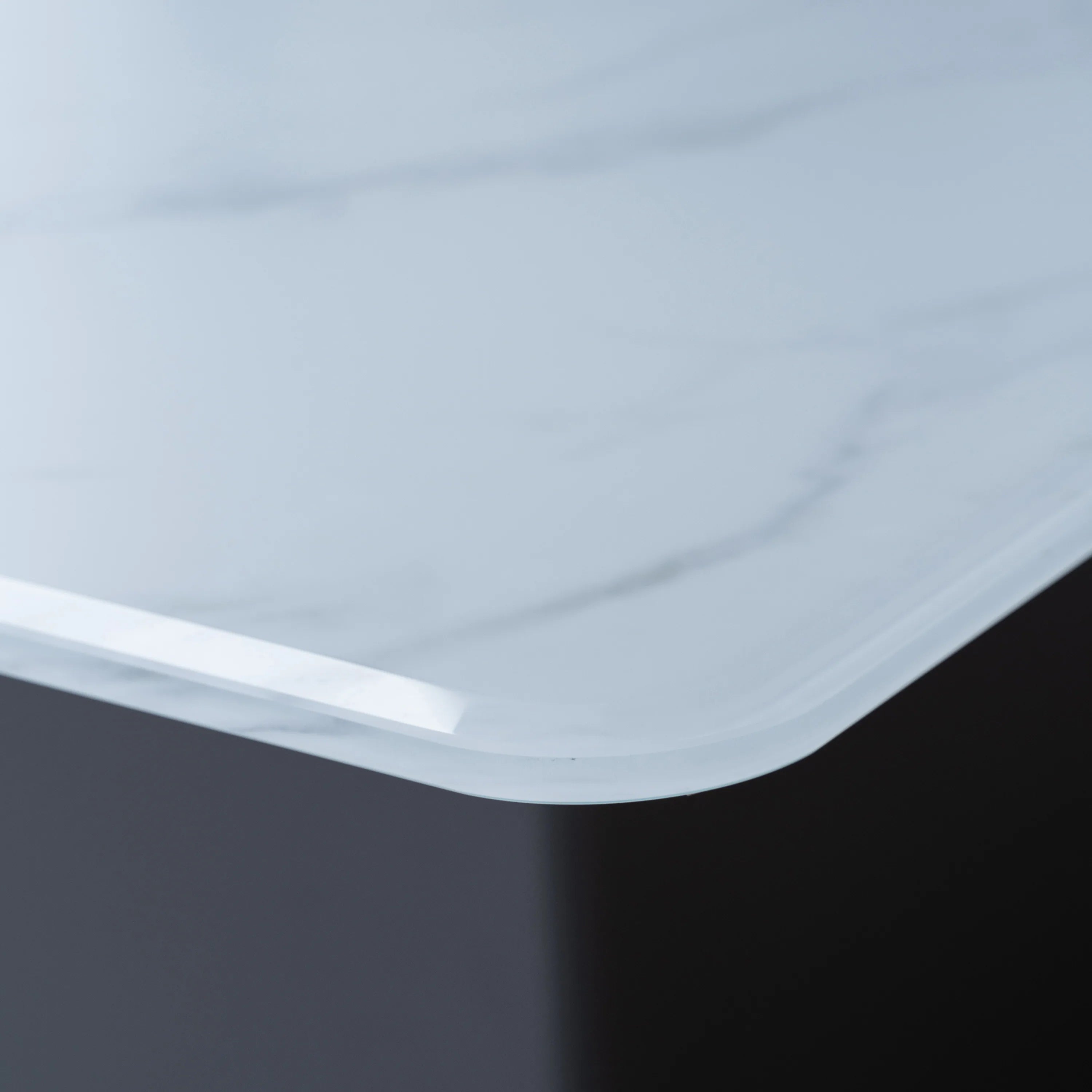 White countertop edge detail with curved profile on smart bar table refrigerator