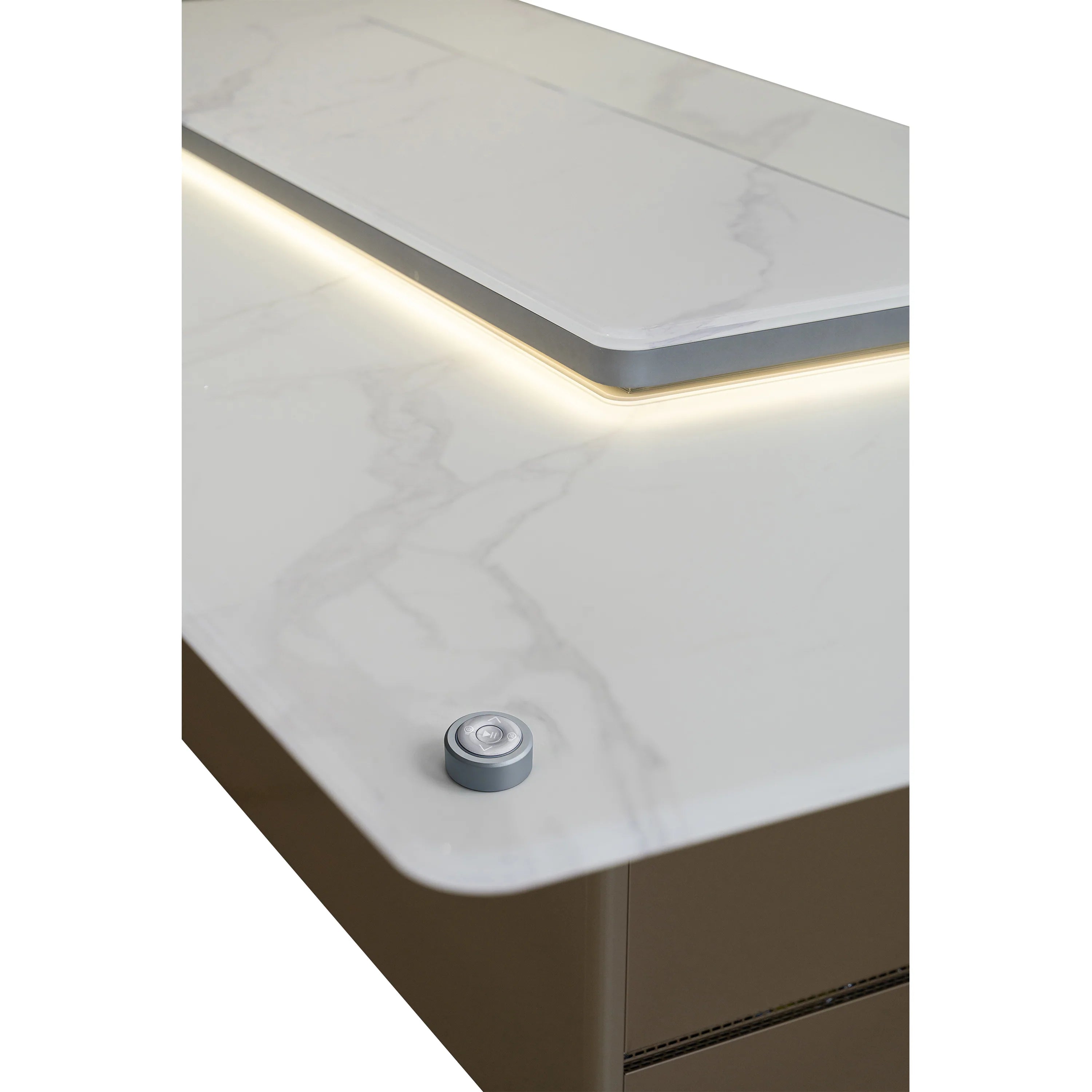 White marble-effect countertop edge with light strip and circular control button