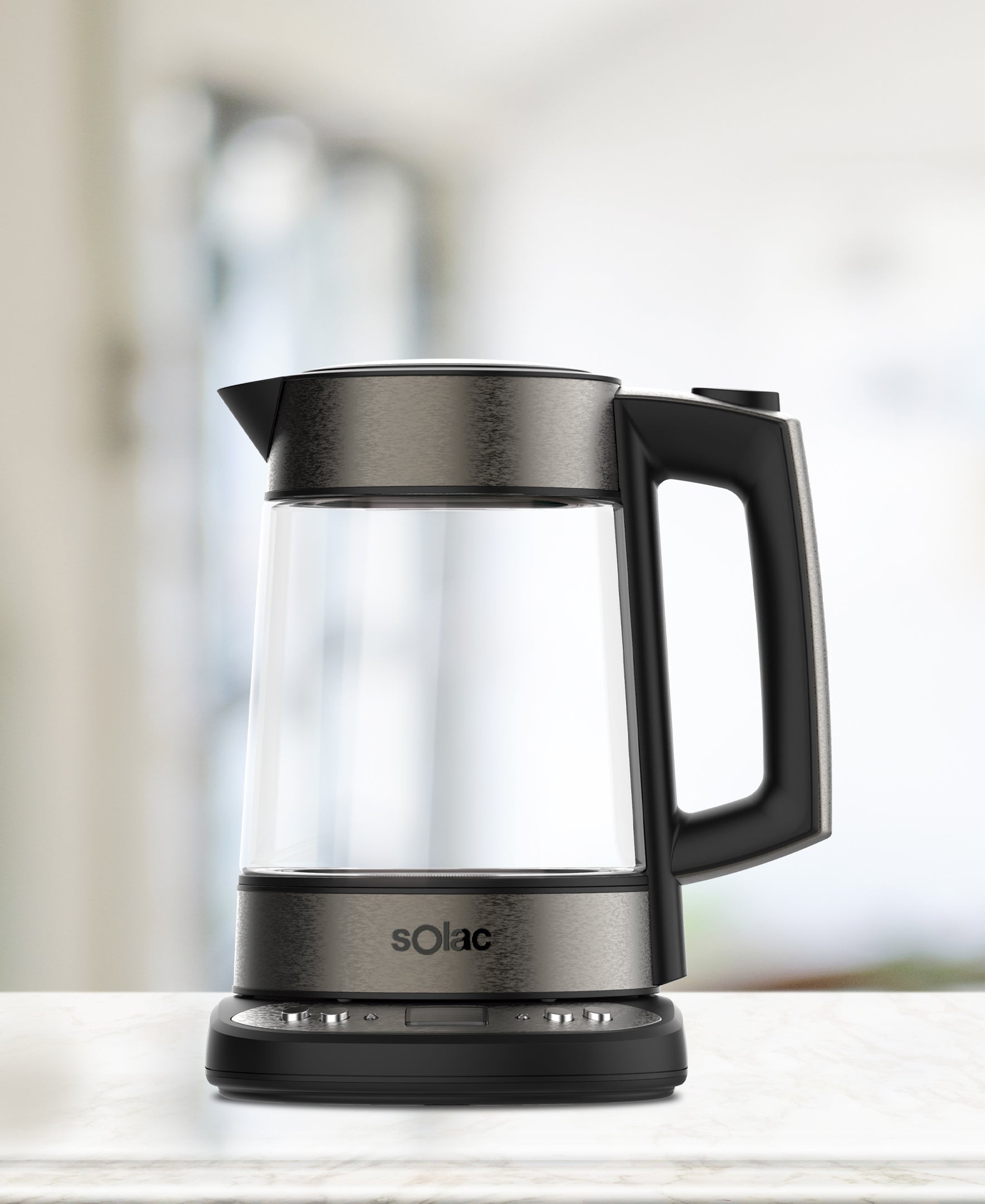 Clear glass kettle with black lid and handle, base control panel