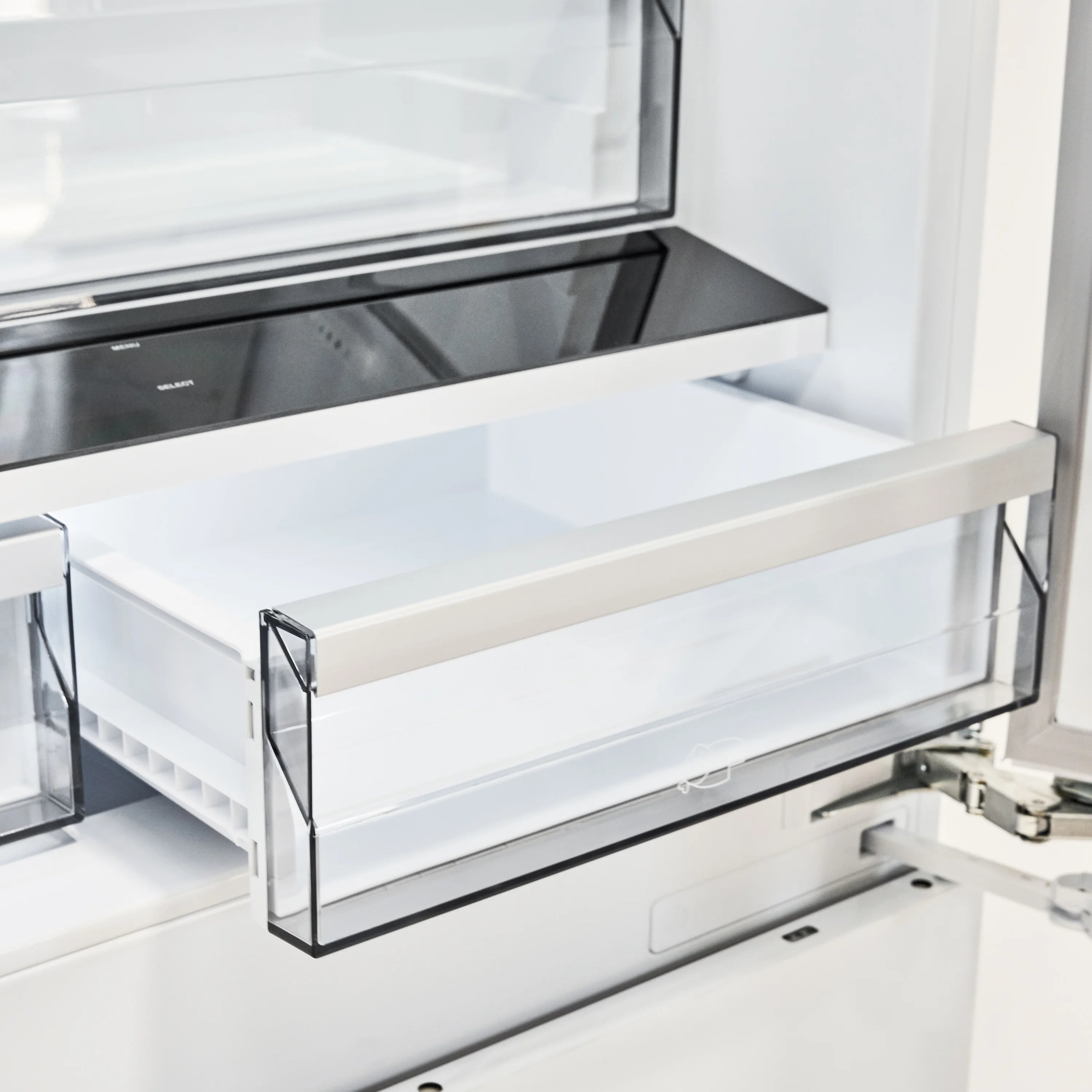 Refrigerator interior with slide-out shelf tray and glass-style cover, white