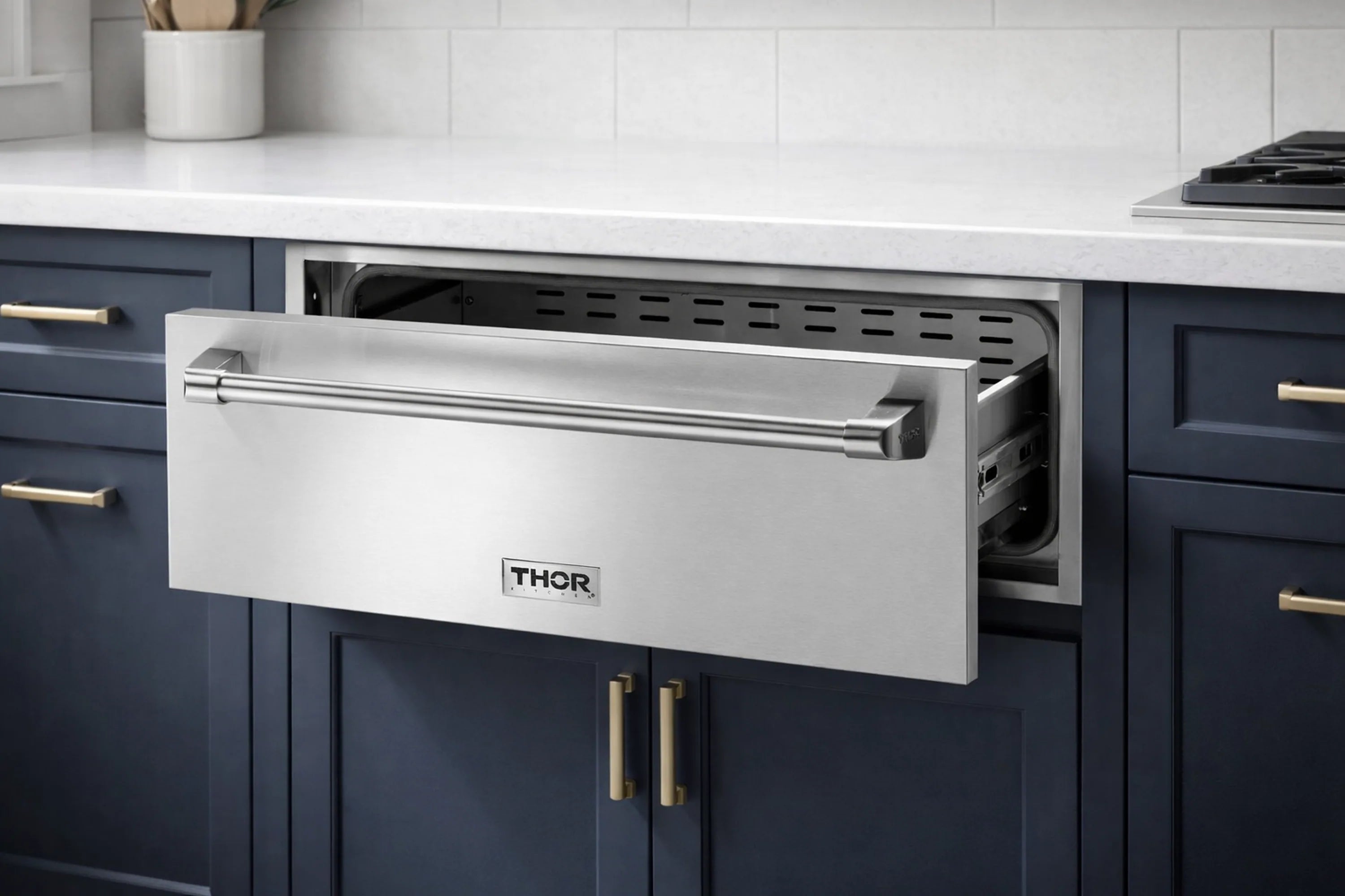 Warming drawer installed under counter, open drawer with interior vented cavity