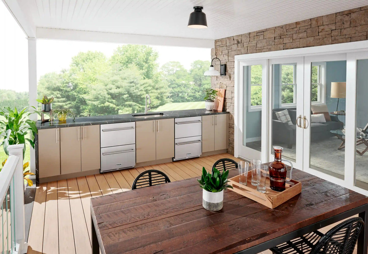 Stainless steel double freezer drawer built into an outdoor kitchen layout