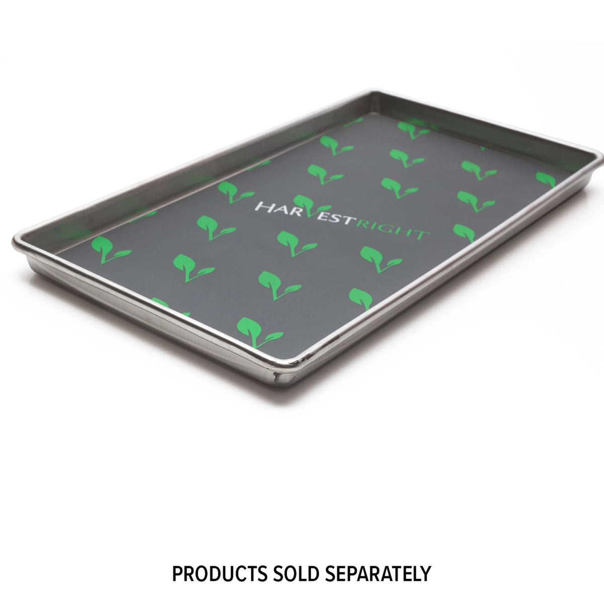 Dark gray silicone mat with green leaf pattern on a metal tray