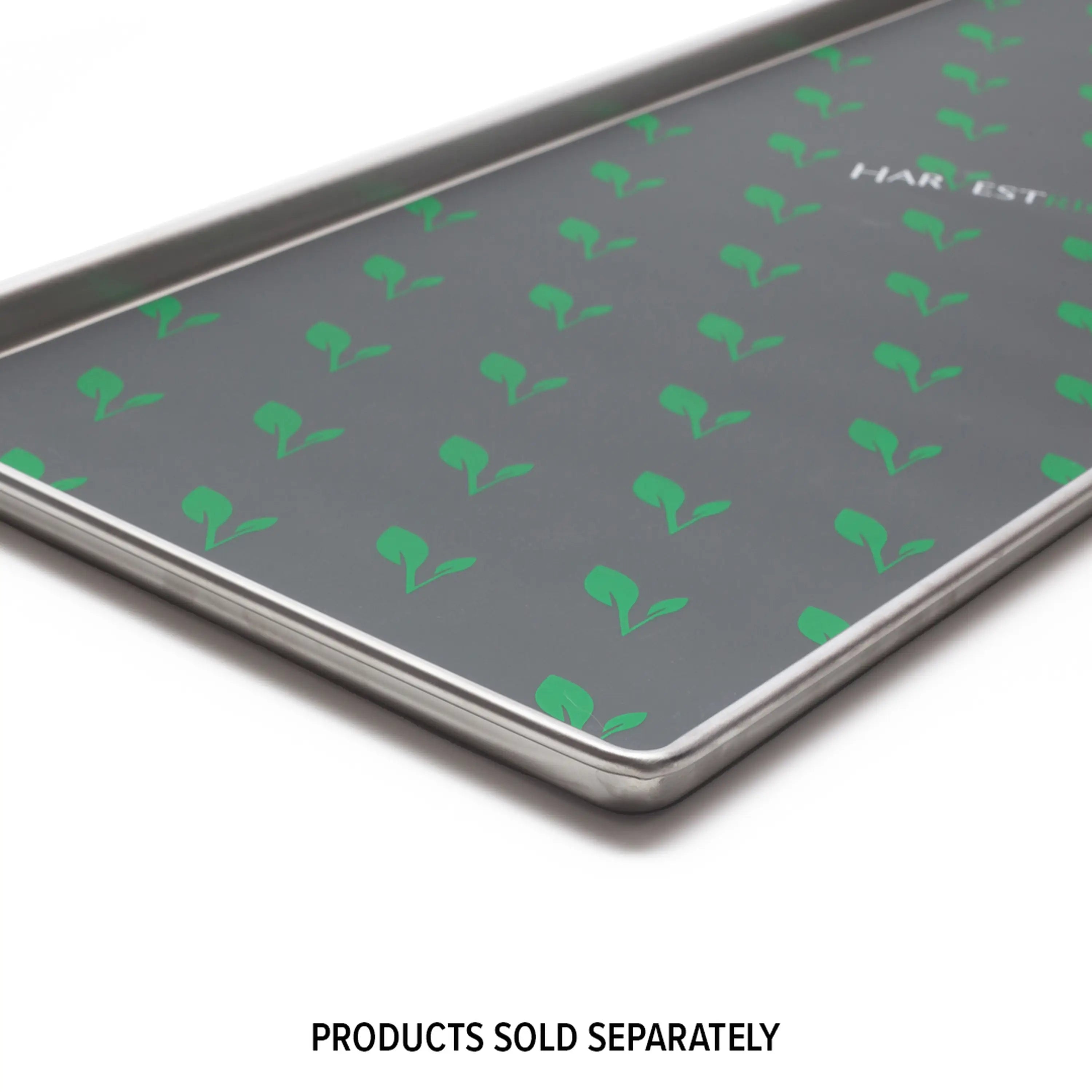 Dark gray freeze dryer tray with green logo pattern and metal edges