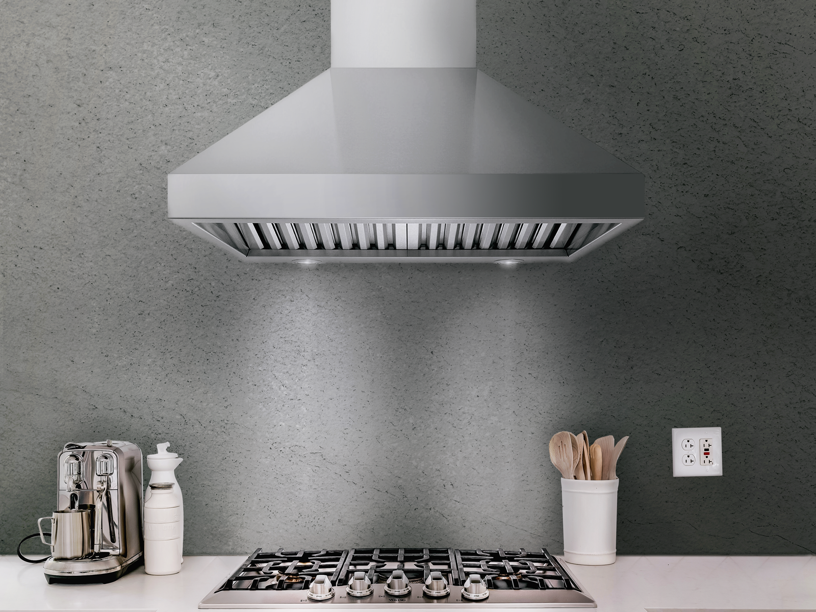 Stainless steel wall-mount range hood with front baffle filters and vent opening