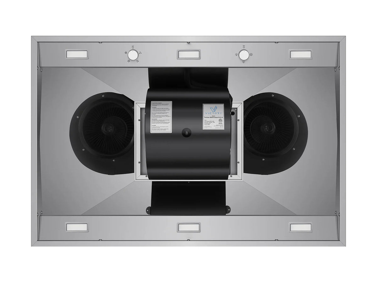 Range hood interior view with dual fan openings and central blower housing