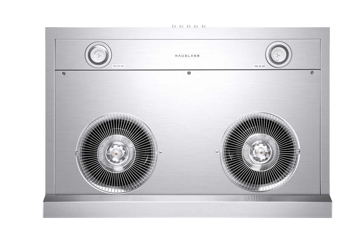 Stainless steel range hood front panel with two circular fan grilles and baffle
