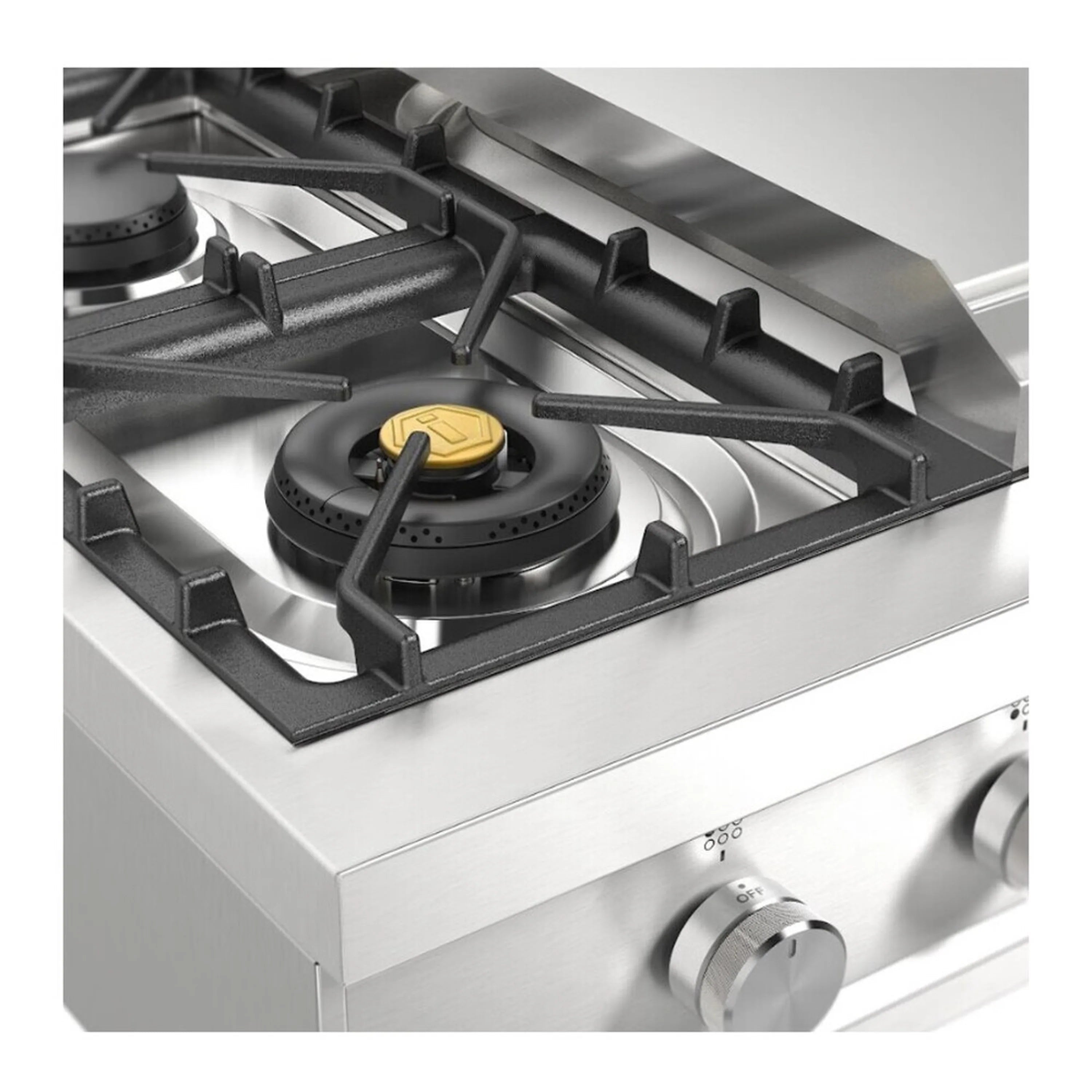 Close-up of gas burner on stainless steel rangetop with black cast-iron grate