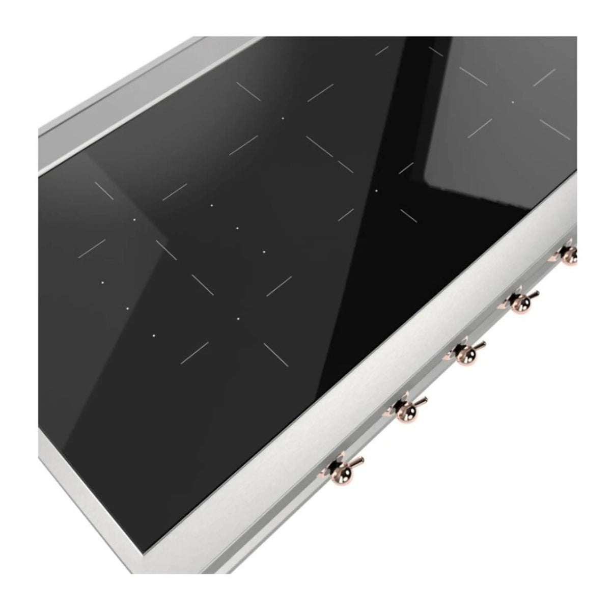 Close-up of built-in induction cooktop edge, black glass surface and copper knobs
