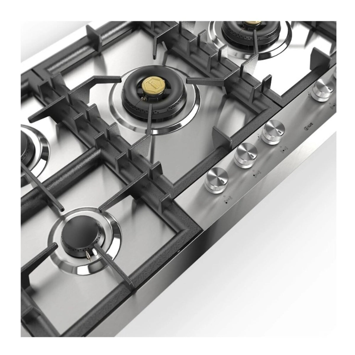 Stainless steel cooktop detail with black grates, brass caps, and burner knobs.