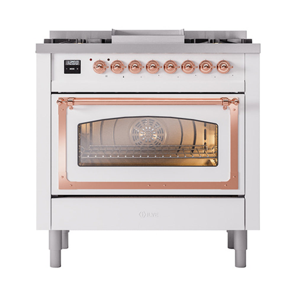 White dual fuel range with copper-trim glass oven door and row of copper control knobs