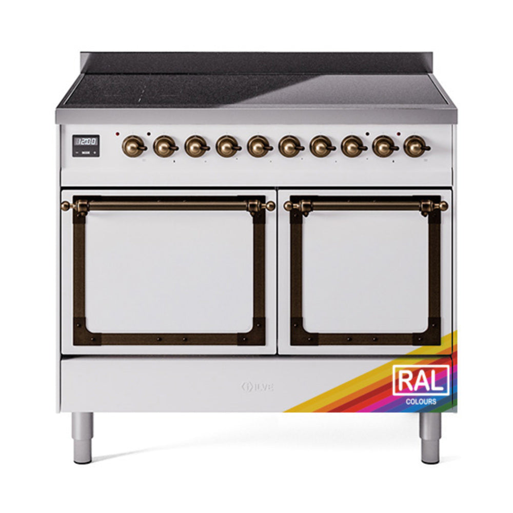 Stainless induction range front with bronze knobs and glass oven doors