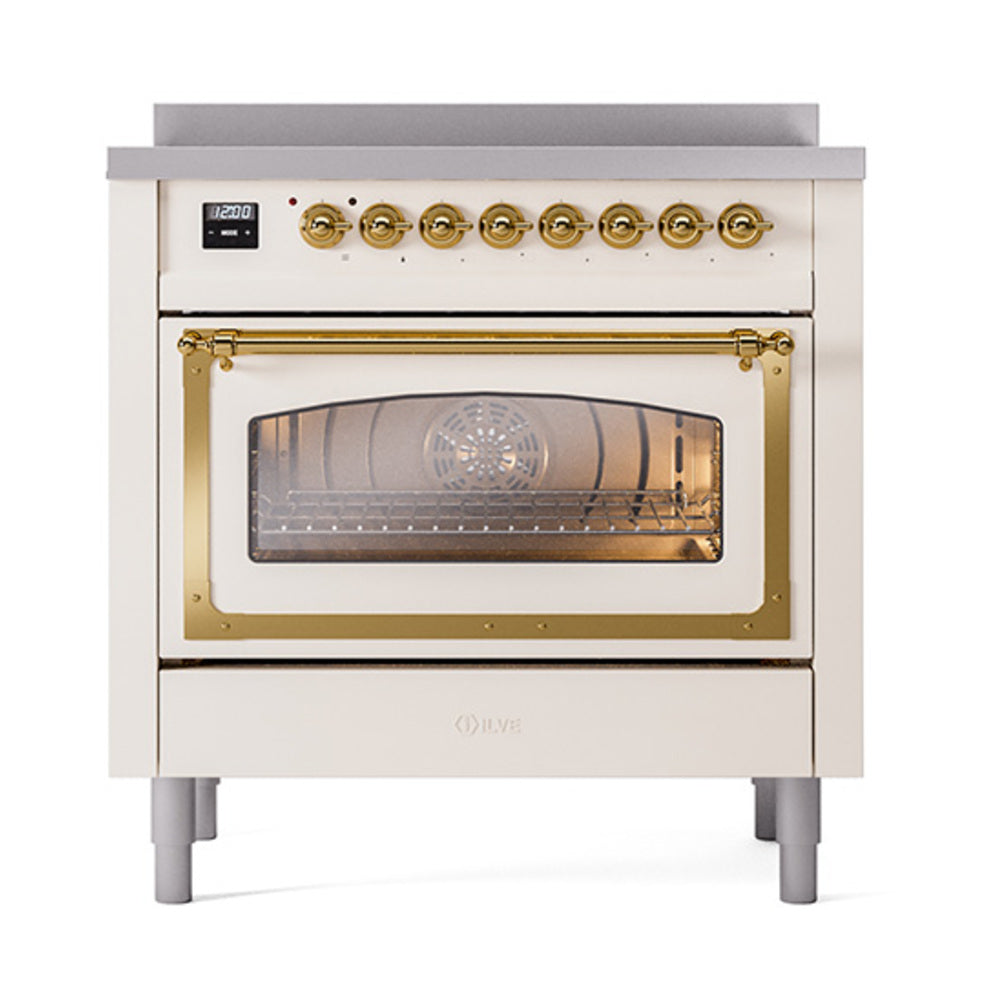 Antique white oven with brass-trimmed glass door and front control display