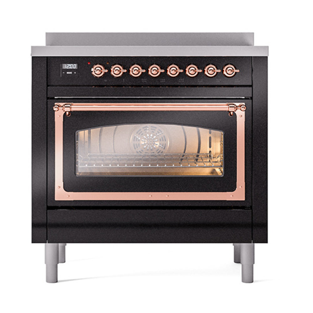 Glossy black induction range with copper-trim oven handle and illuminated glass door