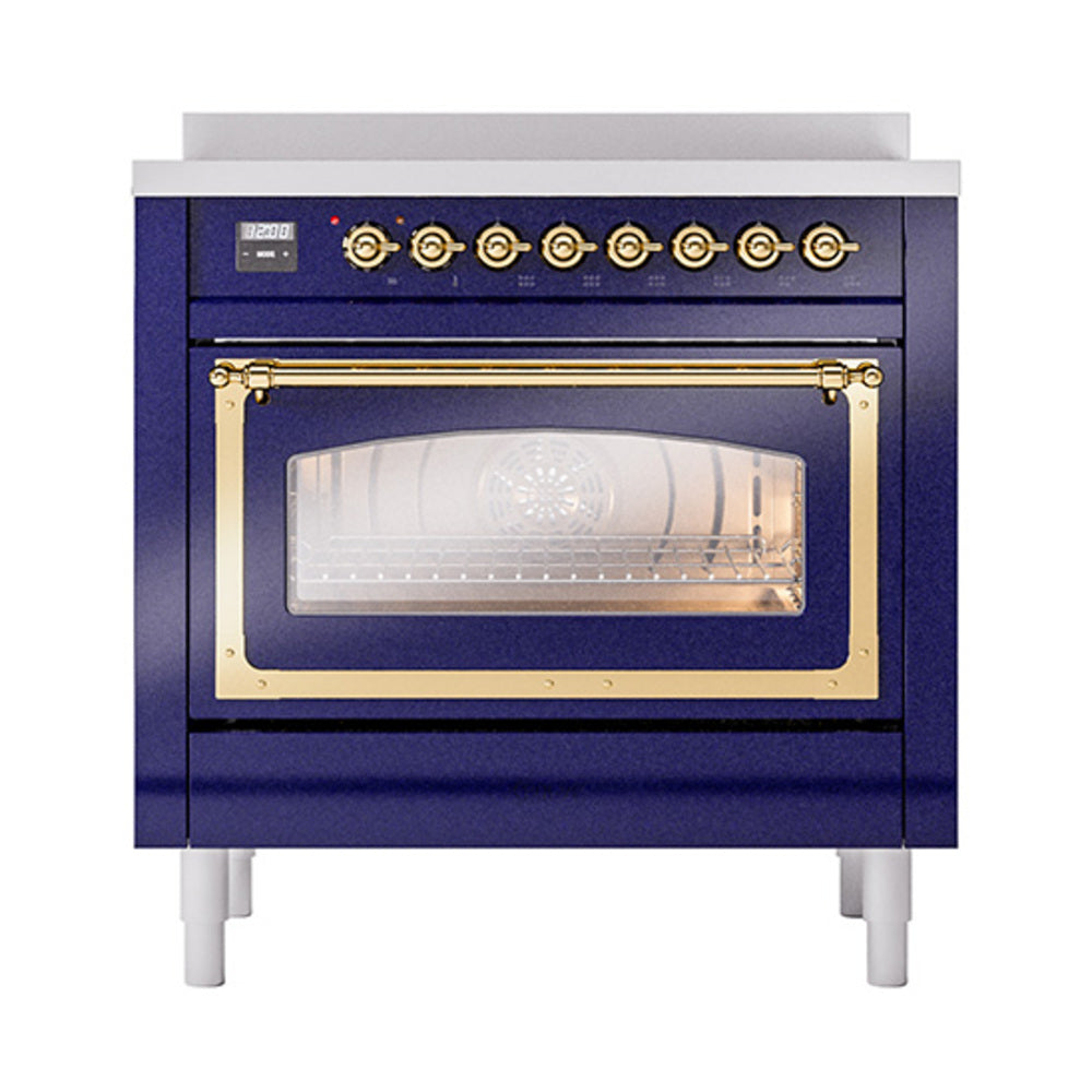 Midnight blue induction oven with brass trim, control knobs, and glass door window