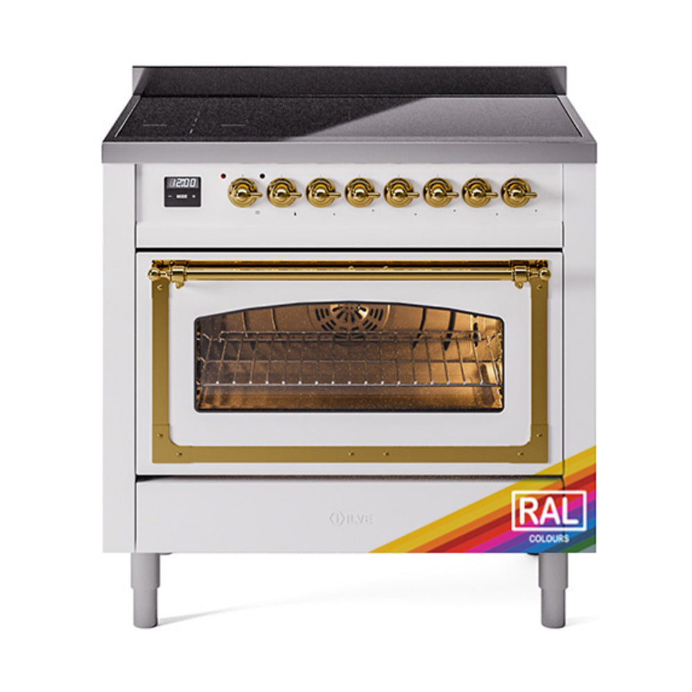 Induction range with brass-trimmed oven door, gold knobs, and large glass window