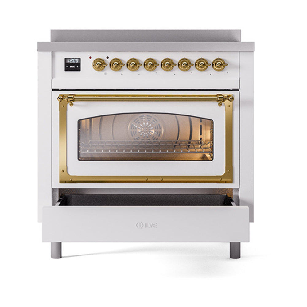 36-inch induction range with brass-trimmed glass oven door and gold control knobs