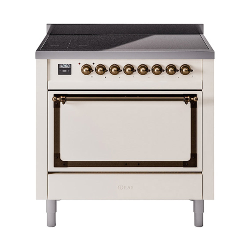 Antique white induction range with closed oven door and bronze control trim