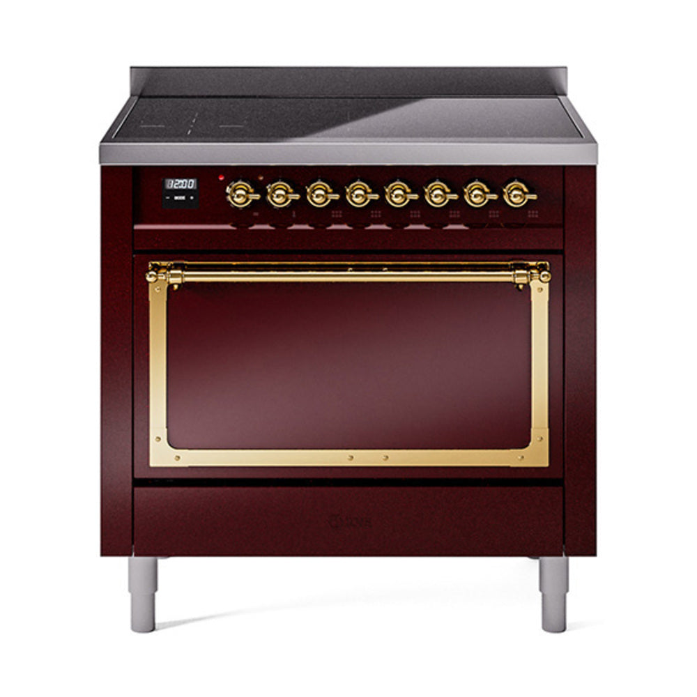 Burgundy induction range with closed oven door, brass handle trim, and control dials
