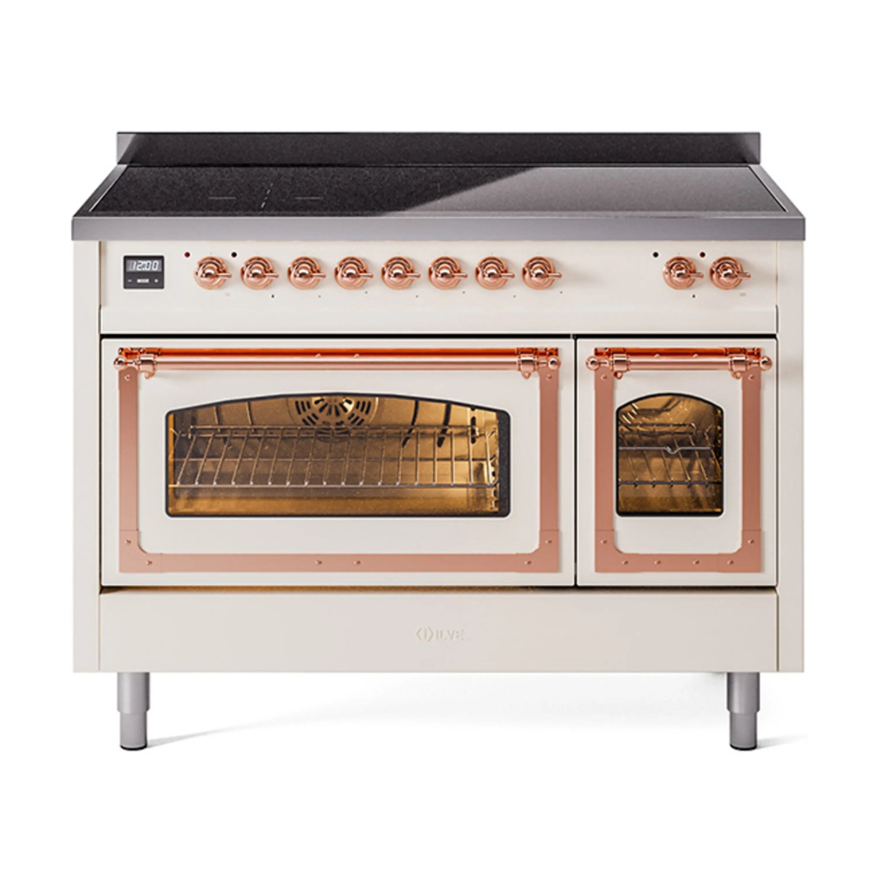 Antique white induction range with copper trim; oven doors open with lit interiors