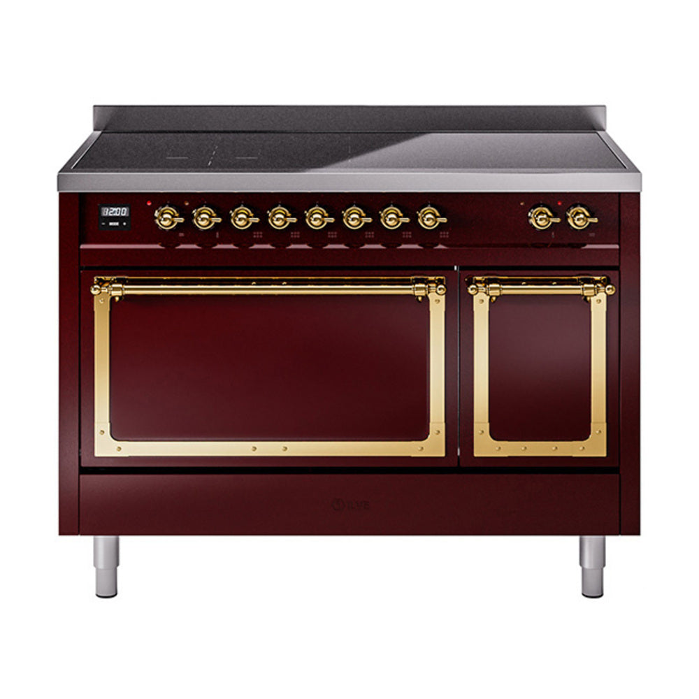 Burgundy induction range with double brass-trim ovens, gold knobs, and griddle top
