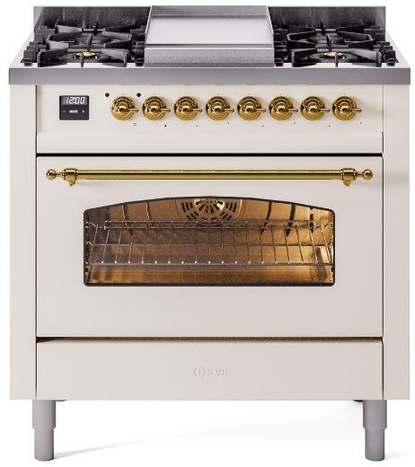 Antique white freestanding dual fuel range with brass knobs and oven window
