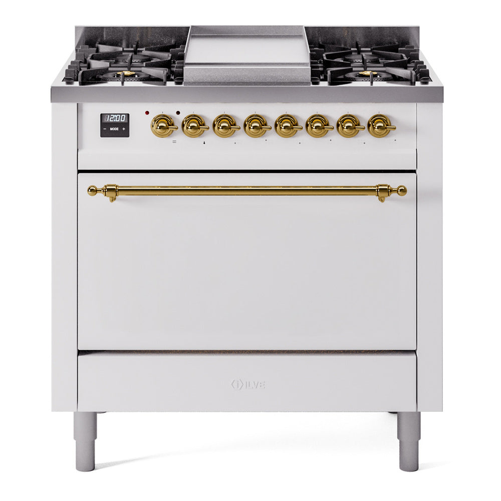 White dual-fuel gas range front view with six burner grates, brass control knobs, and oven door