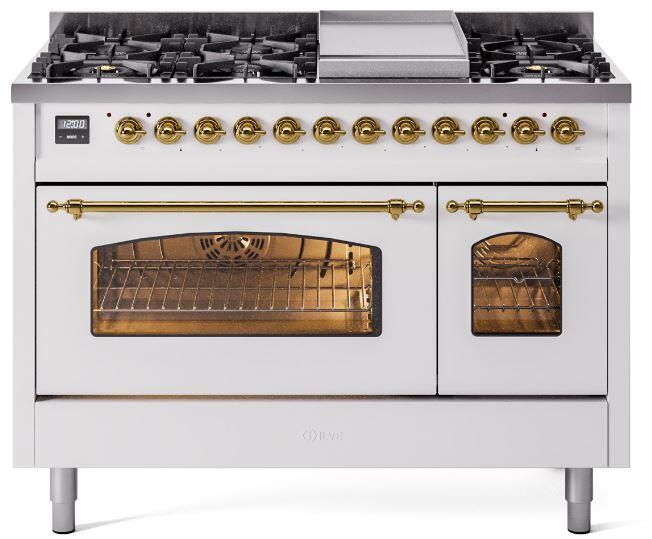 White freestanding dual fuel range with brass trim; main and small ovens open; burners on top.