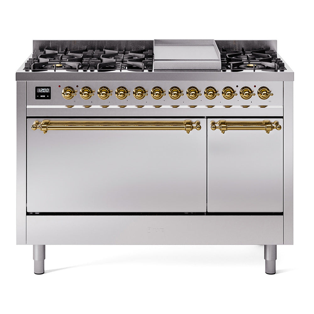 Stainless dual-fuel range with brass control knobs and central griddle