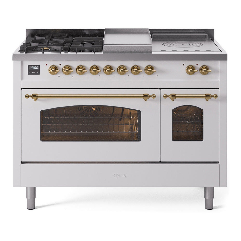 White dual fuel range with brass knobs, gas cooktop, griddle, and dual ovens with glass doors