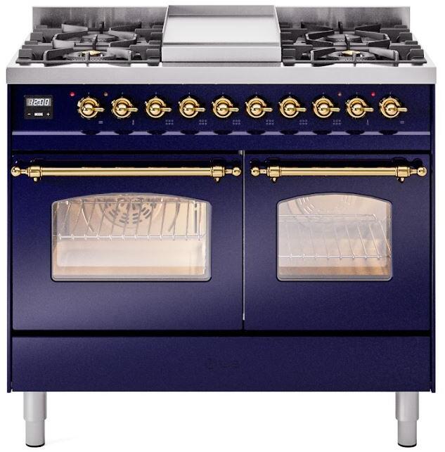 Freestanding dual fuel range front with brass knobs, burner grates, and glass oven doors
