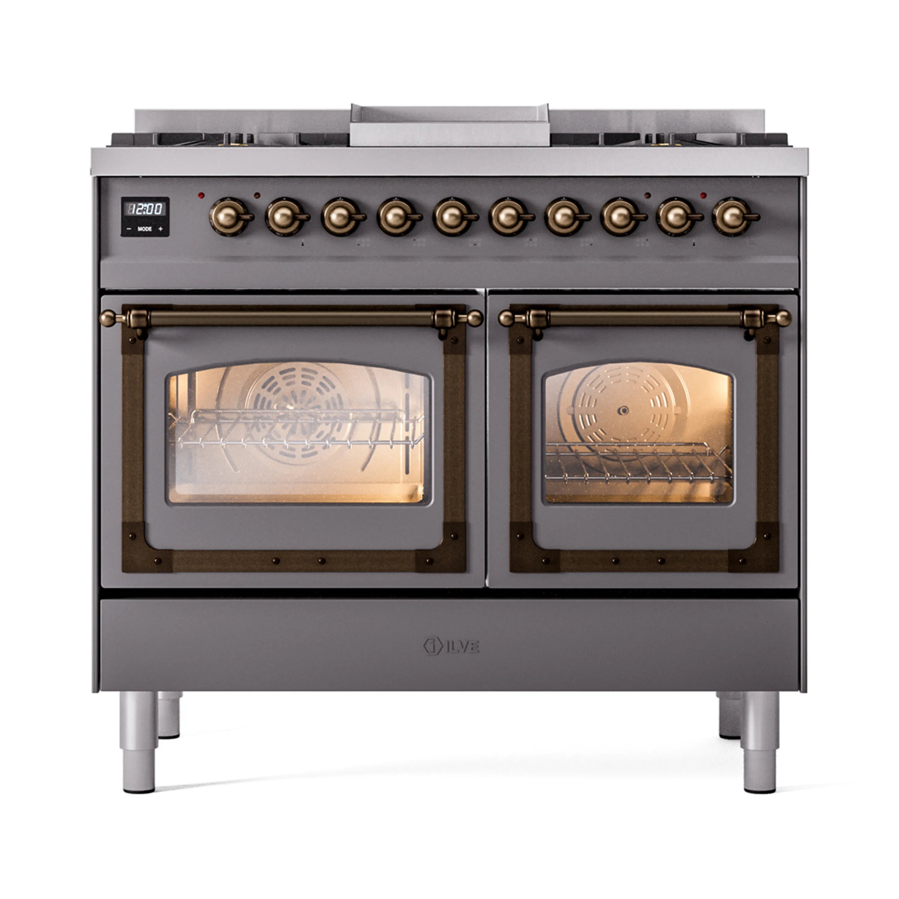 Matte graphite gas range with bronze knobs and dual ovens showing racks through glass