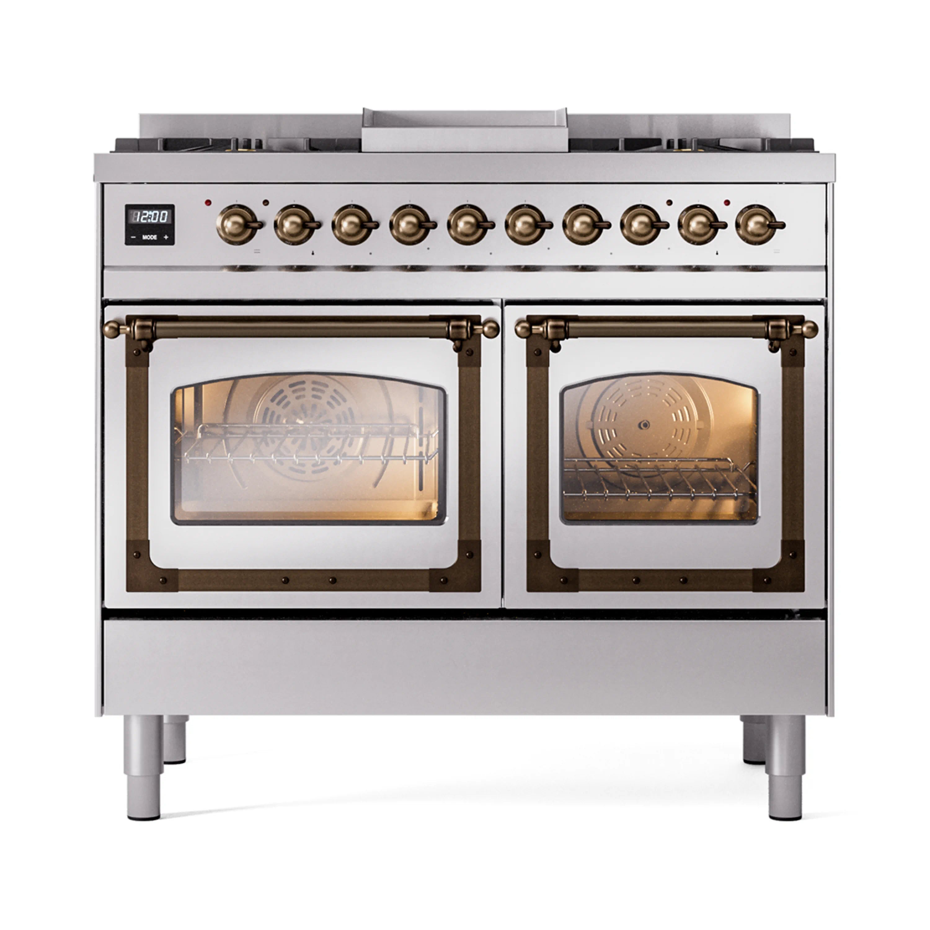 Stainless dual-fuel range with bronze trim, two open ovens, and control knobs on back panel