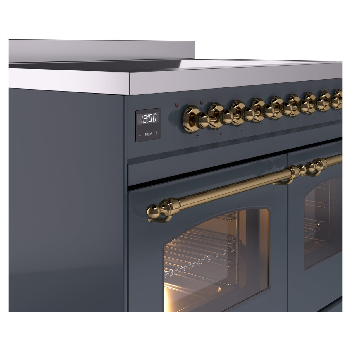 Blue-grey induction range control panel with brass rotary knobs and brass oven handle rails