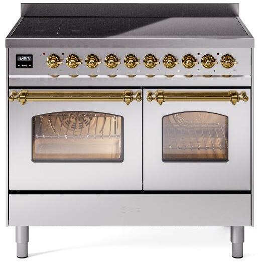 Stainless induction range with brass knobs and two oven windows, front angle view
