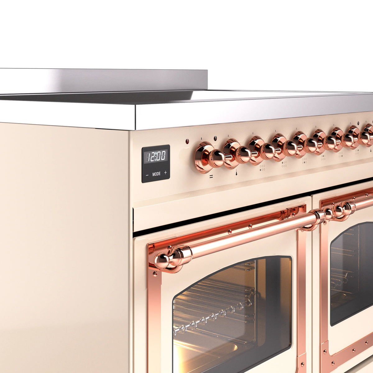 Antique white induction range close-up of copper control knobs, display, and oven handles.