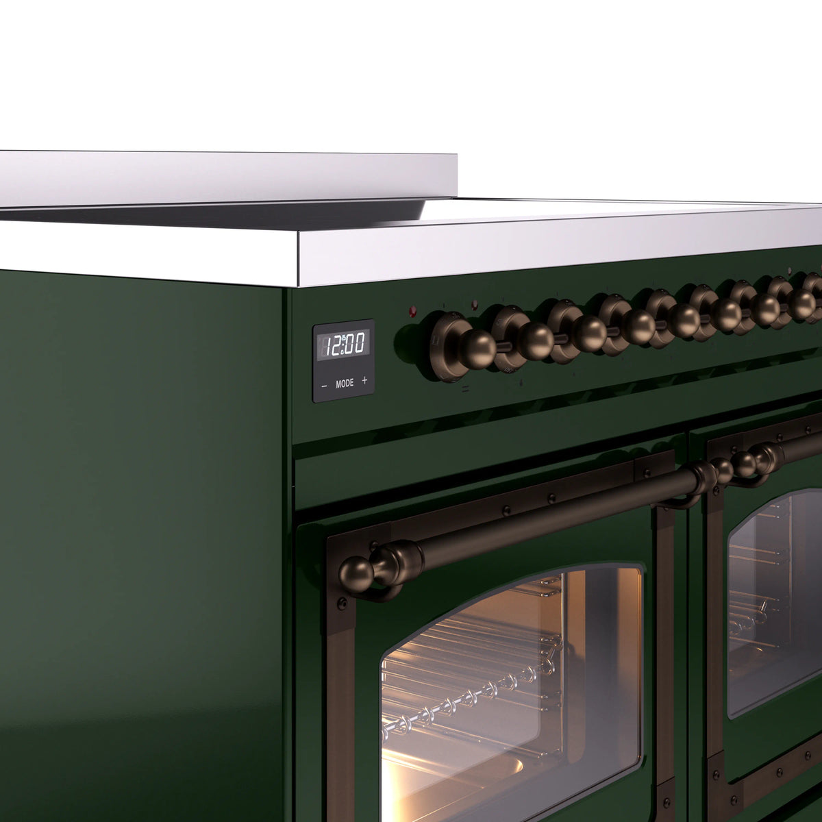 Emerald green induction range control panel with bronze bead knobs and lit oven door