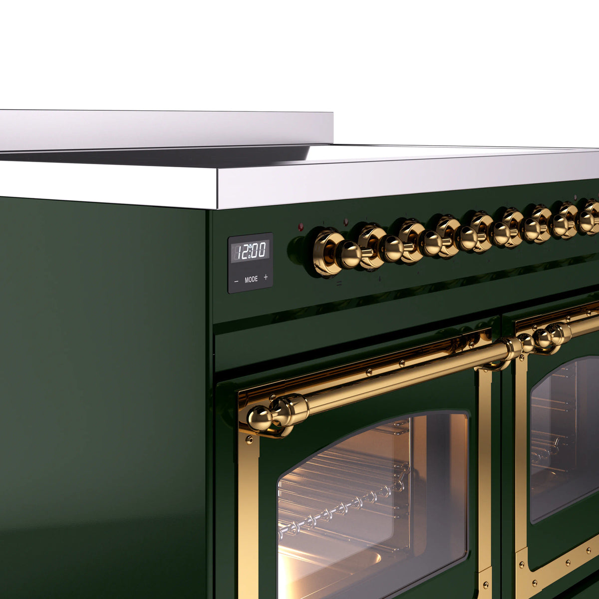 Emerald green range control panel with brass knobs and brass oven door handle