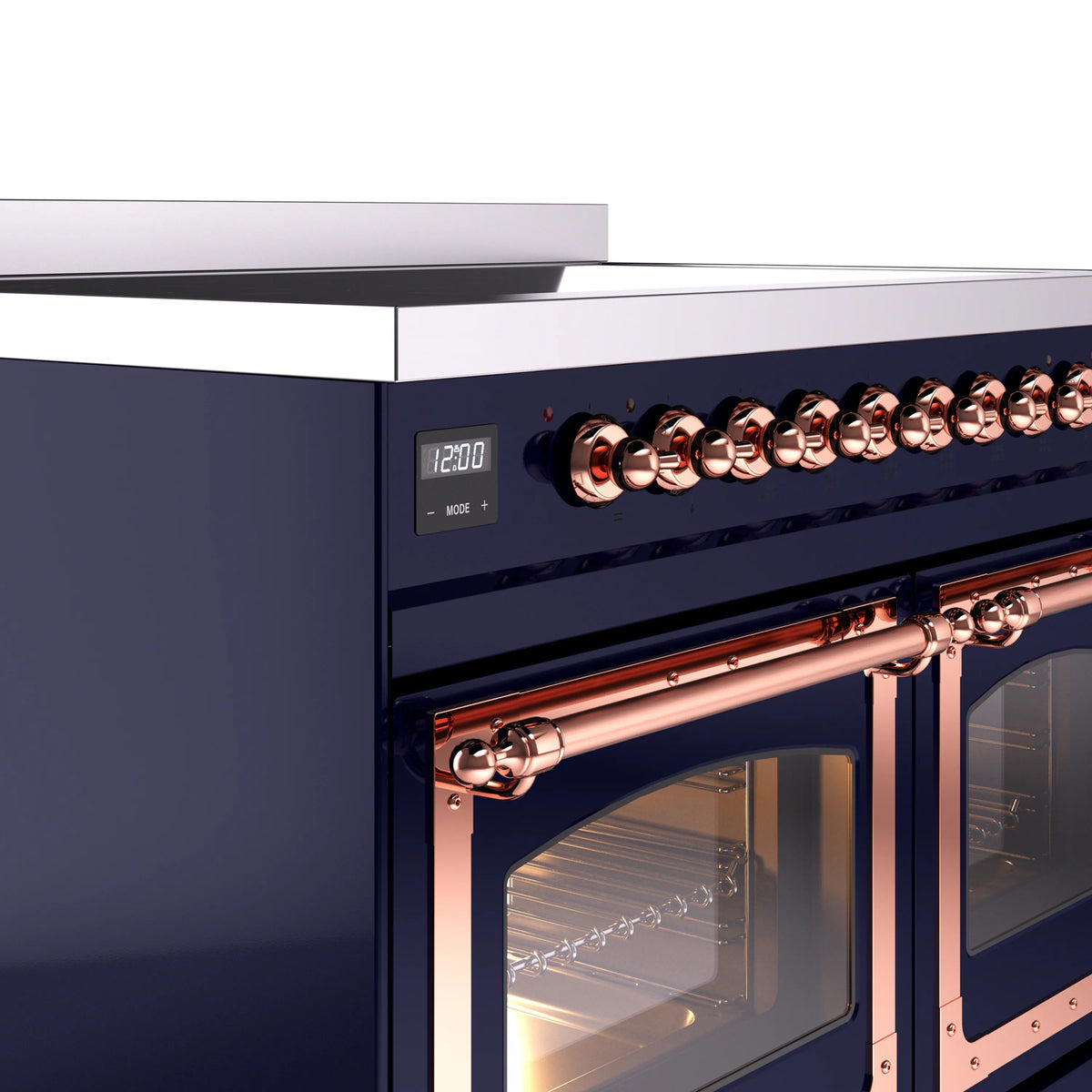 Copper control knobs and burner area on midnight blue induction range, side close-up