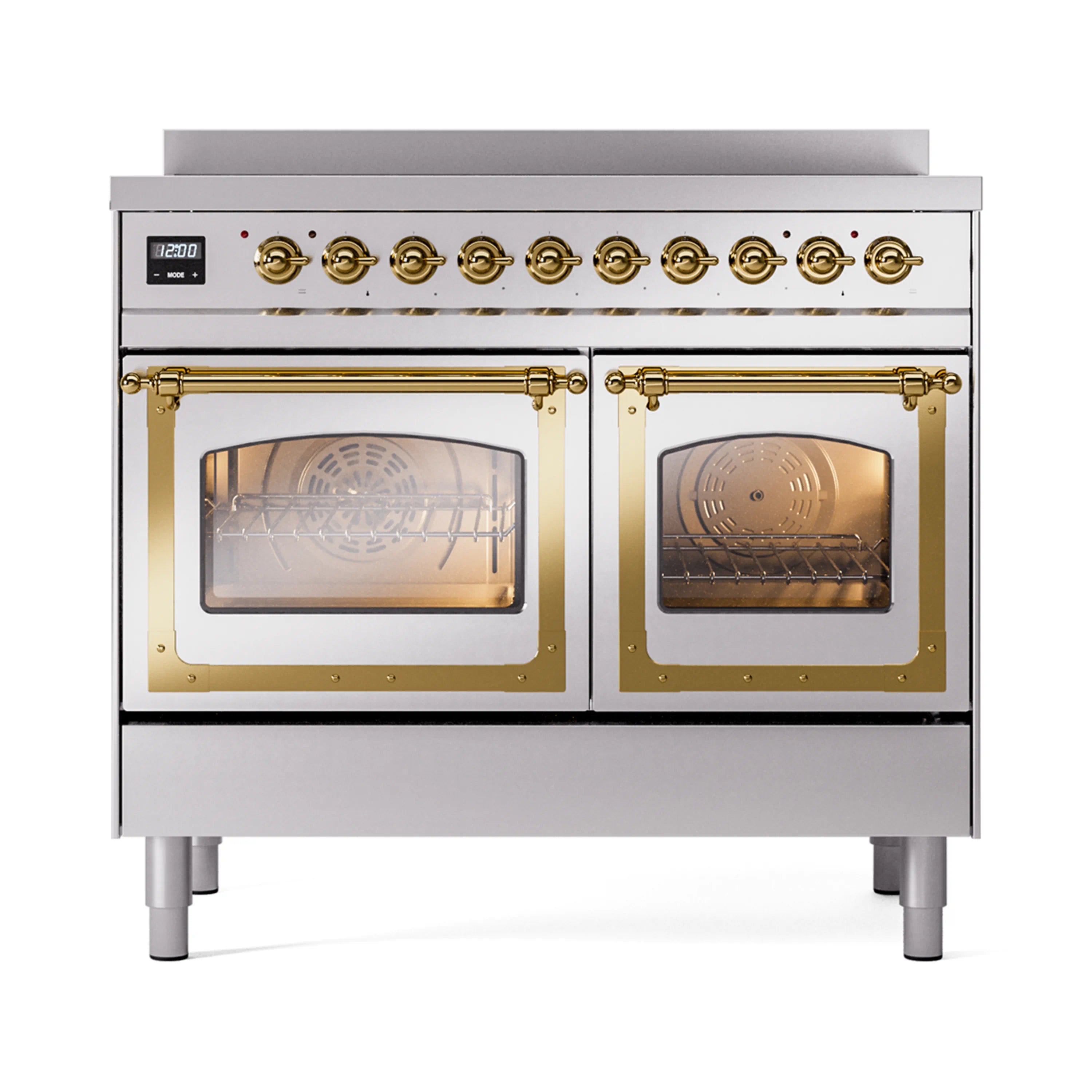 Stainless steel induction range with glass oven doors closed and brass control knobs