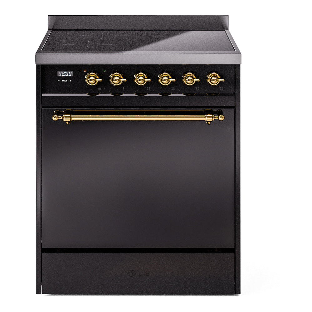 Glossy black induction range front with brass control knobs and oven door handle