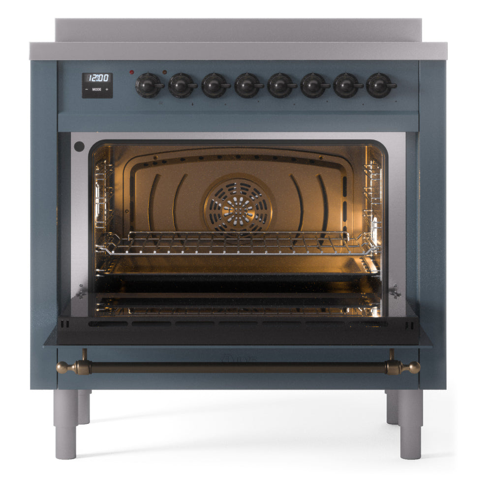 Freestanding induction range with oven door open, lit interior and oven rack inside