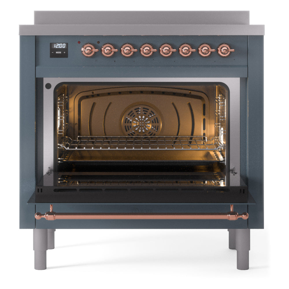 Open oven cavity of blue grey induction range with copper-trim control panel